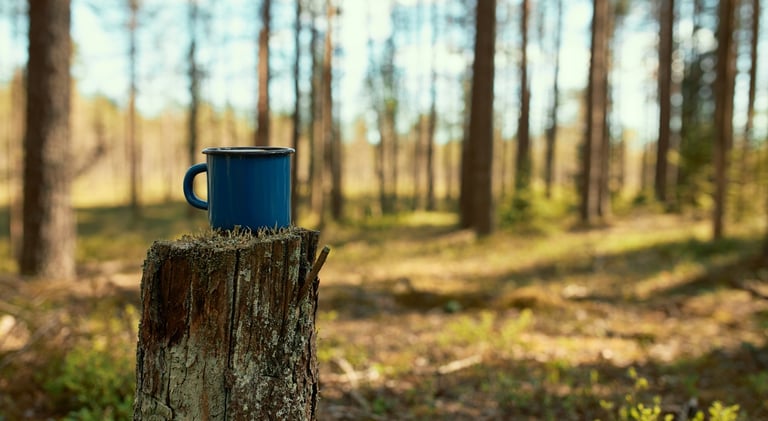 a mug of coffee in a mug on a stump stump stump