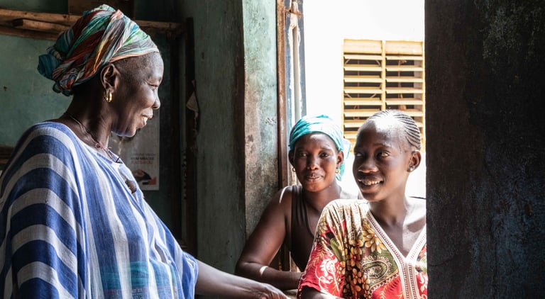 Fanta Wilane, a smallholder farmer with her two daughters