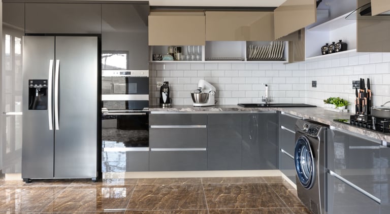 a kitchen with a refrigerator and a refrigerator freezer