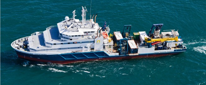 a boat with a large boat in the water
