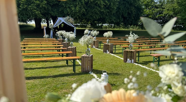 a cross - country wedding ceremony with flowers and a cross