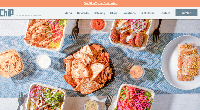 A website showing a flatlay of Middle Eastern food