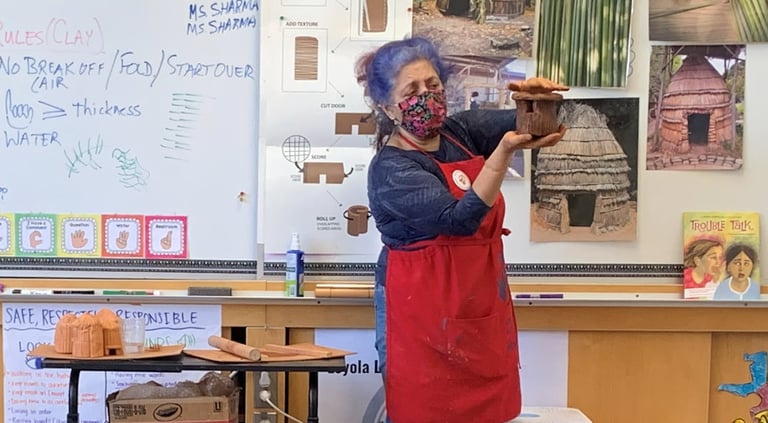 docent teaching a clay lesson