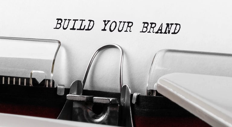 Typewriter with 'BUILD YOUR BRAND' on the paper