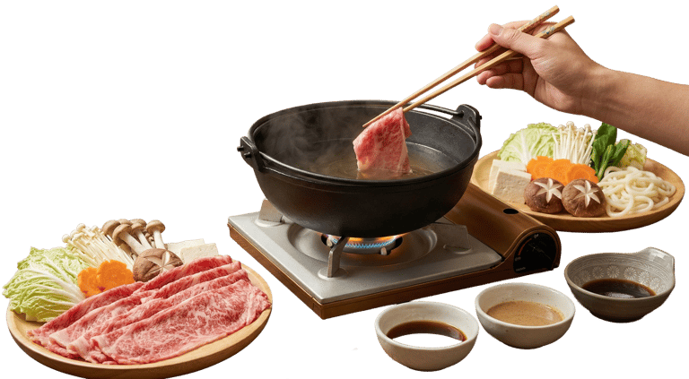 Thinly sliced premium beef and fresh vegetables prepared for a traditional Japanese shabu-shabu style hotpot.
