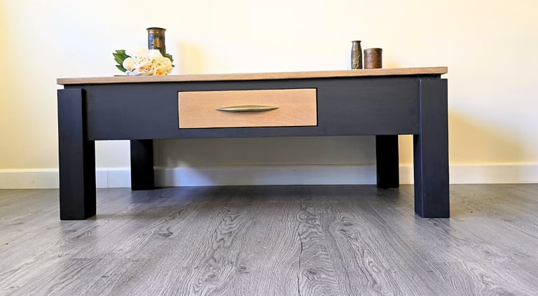 Image of a painted coffee table with a natural wood top and drawer