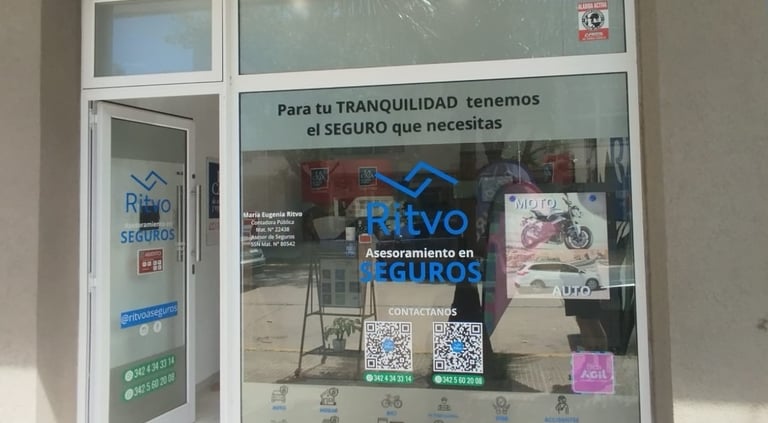 Ritvo Seguros office storefront featuring glass windows with insurance service decals and QR codes.
