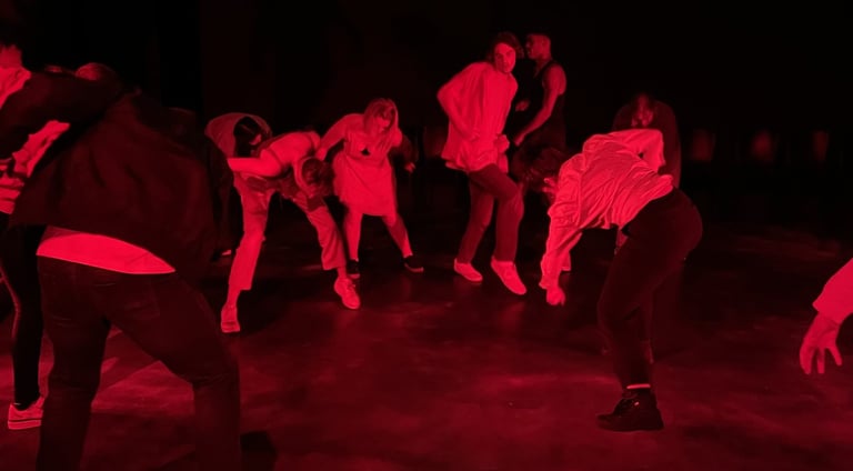 a group of people dancing in a dark room