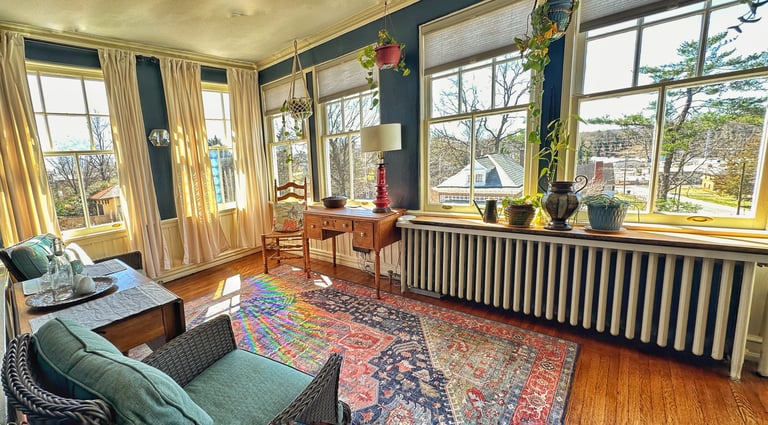 sunroom with view of windows 2123 rivermont apartments