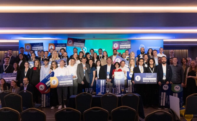 a group of people standing in front of a stage