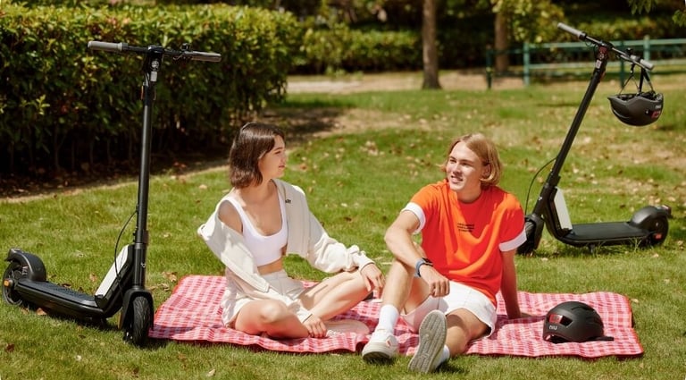 two people sitting on a blanket on a blanket