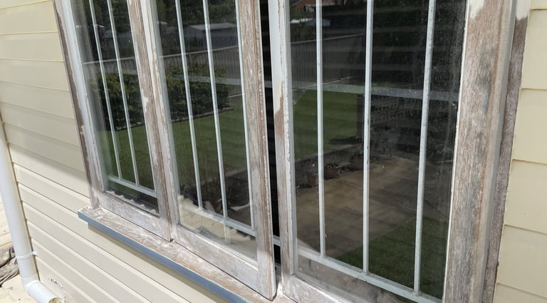 Weathered window frame before exterior repainting by PJCPainters