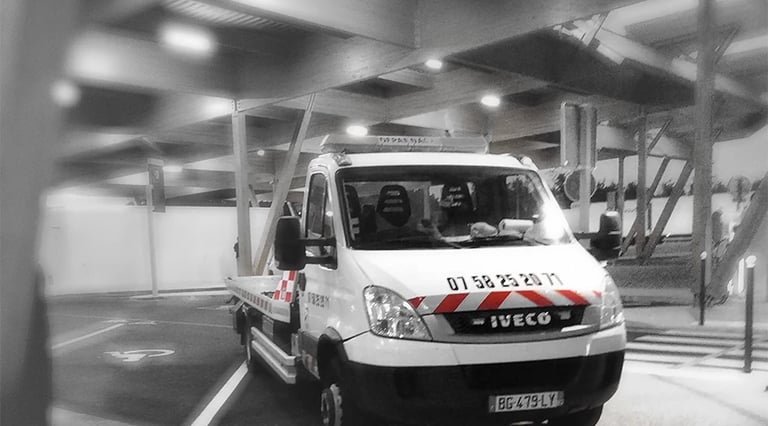 a white van parked in a parking lot