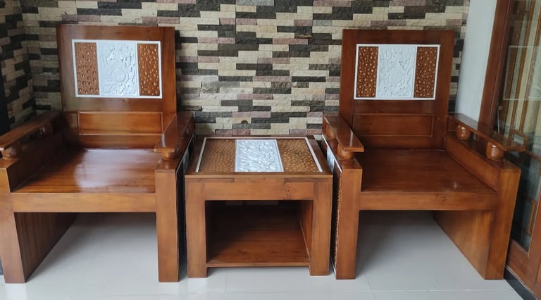 two wooden chairs with a table and chairs