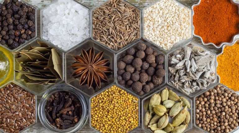 a tray of whole spices and some powdered.