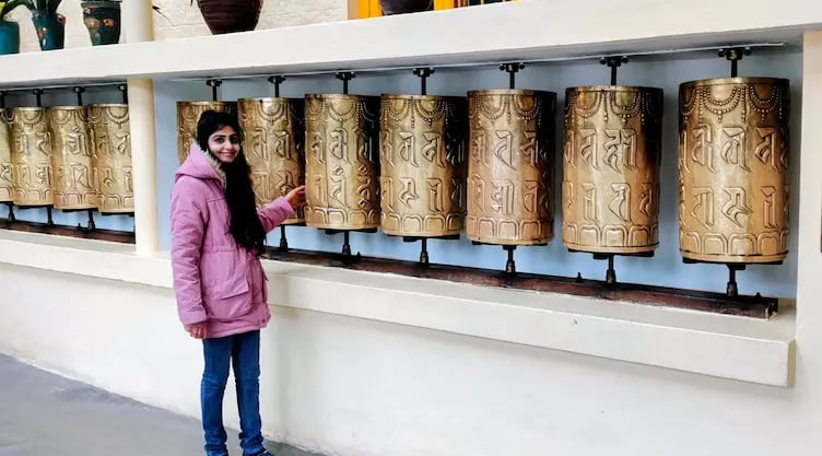 Tibetan prayer wheels at the Dalai Lama Temple in McLeod Ganj, Dharamshala, symbolizing peace, faith, and Buddhist tradition.