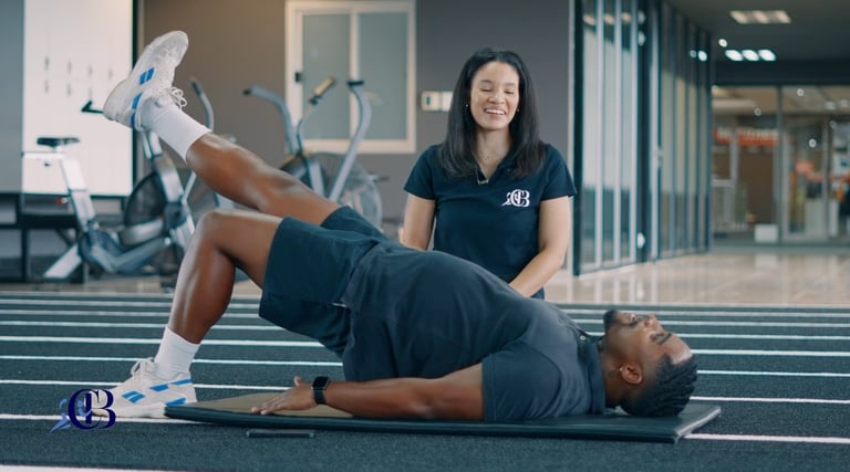 Biokineticist assisting with knee rehabilitation in Randburg