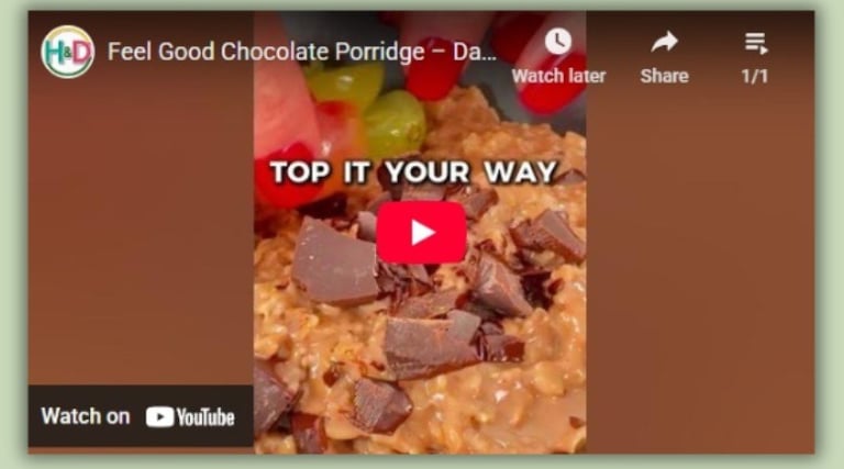 Chocolate porridge with grapes and dark chocolate — a warm, healthy Mediterranean breakfast.