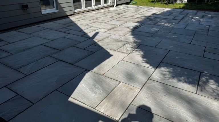 Levelled patio slabs in Worcester garden by B R Building and Landscapes