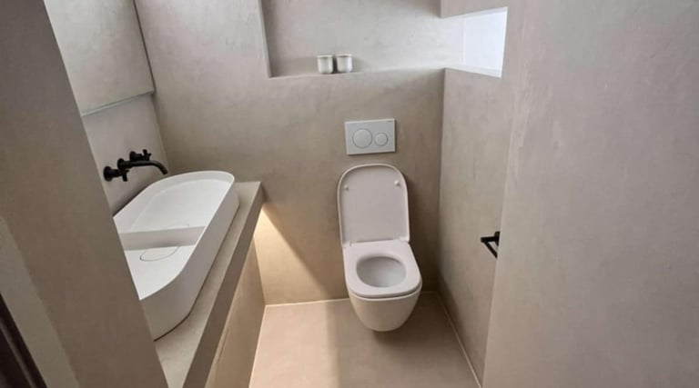white ceramic toilet with matching sink in contemporary Pershore bathroom