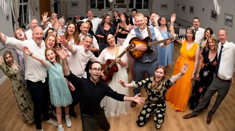 Wedding musicians having fun party with bride and groom