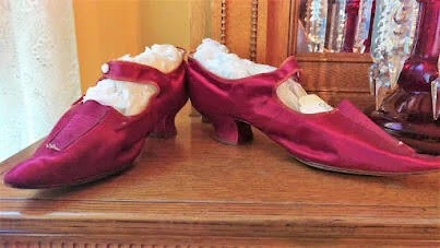 Salem, OR - Red pointy satin shoes worn by women in the early days of the Deepwood Manion 