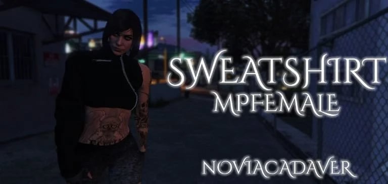 a woman in a black top and a black top with a tattoo on her chest