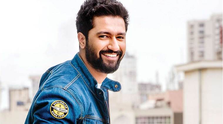 a man with a beard and a beard, smiling