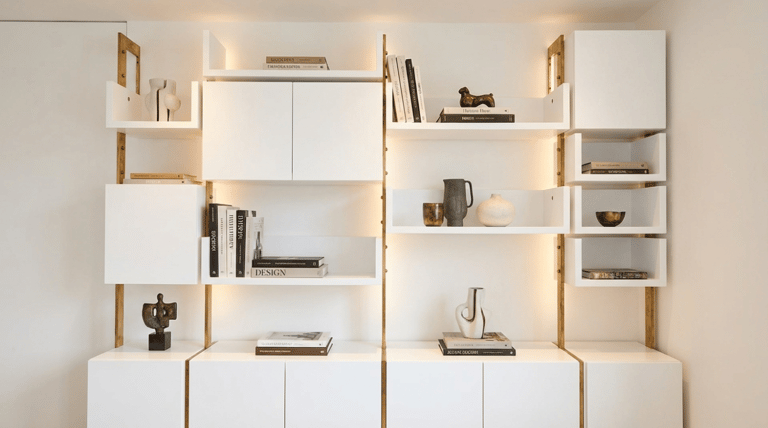 Bespoke wall shelving with bronze frame 