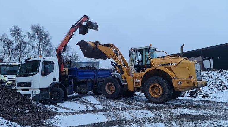 CMR digger loading topsoil onto grab lorry in Stourbridge residential site