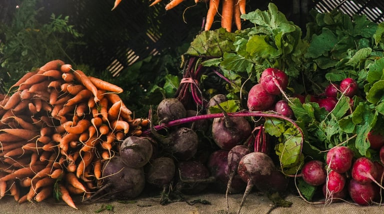 a bunch of vegetables are on display in a market