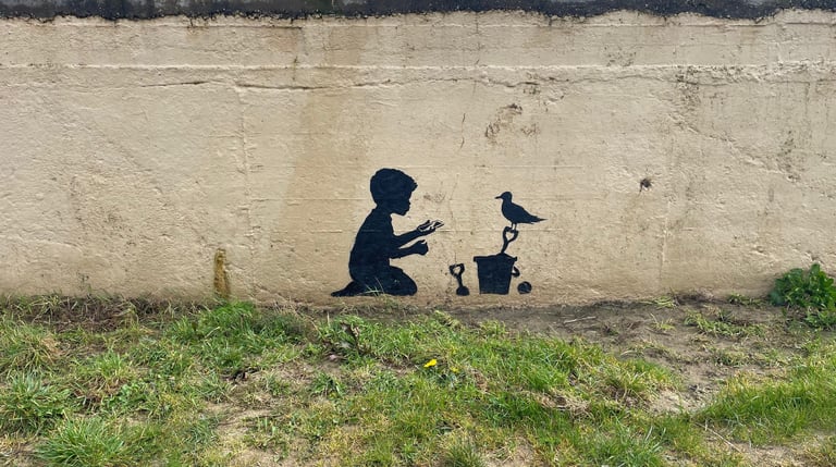 A fake Banksy on the seafront at Hoylake