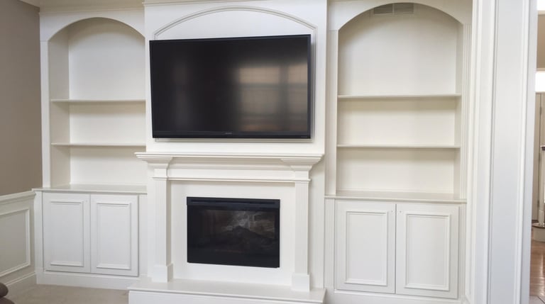 Custom fireplace wall with television and built-in cabinetry in NJ