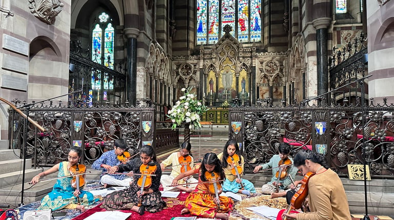 A picture of Srividya Venkat and students performing