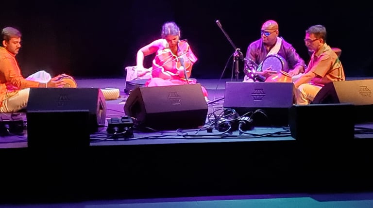 A picture of artists performing in an auditorium
