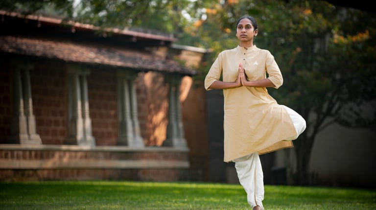 a women hold variksh asna or tree posture