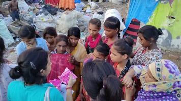 Ambassador Pooja G with a group of ten girls.
