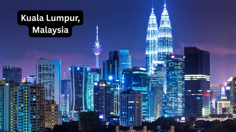 A stunning night view of the illuminated Kuala Lumpur skyline in Malaysia. The twin Petronas Towers 