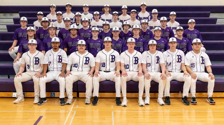 Blair high school baseball team posing for a formal group portrait on gym bleachers.
