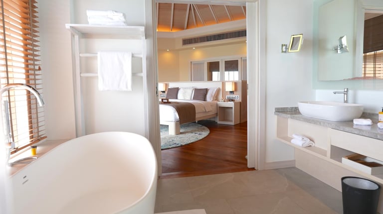 Baros Maldives overwater pool villa bathroom