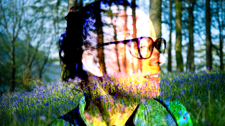 a womans face woodland shining thru her face