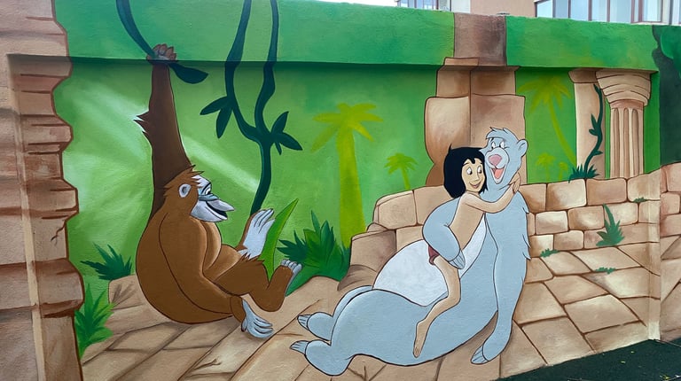 Pictură gard Cartea Junglei Mowgli.