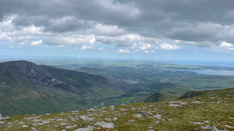 a view out to the sea from the summit of the Carnedds