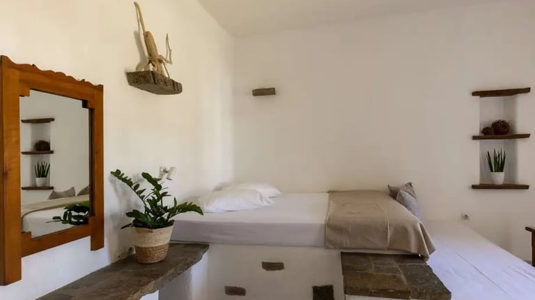 a studio with a comfortable double bed