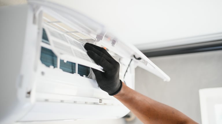 a man in gloves and gloves is holding a remote control unit