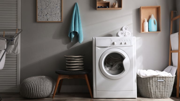 a laundry room with a washing machine and a laundry basket