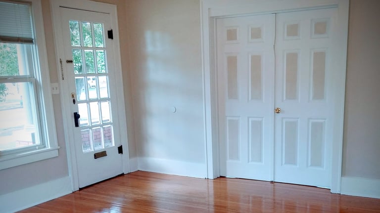 Beautifully painted living room with custom painted two-tone double doors