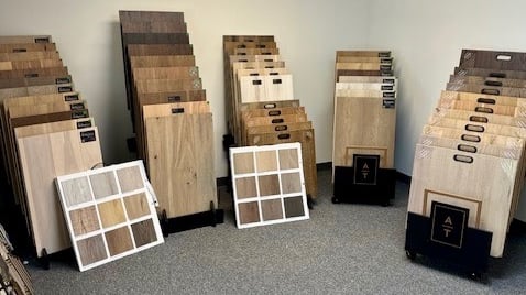 Showroom with a variety of hardwood flooring, prefinished hardwood flooring, LVP, and carpet options