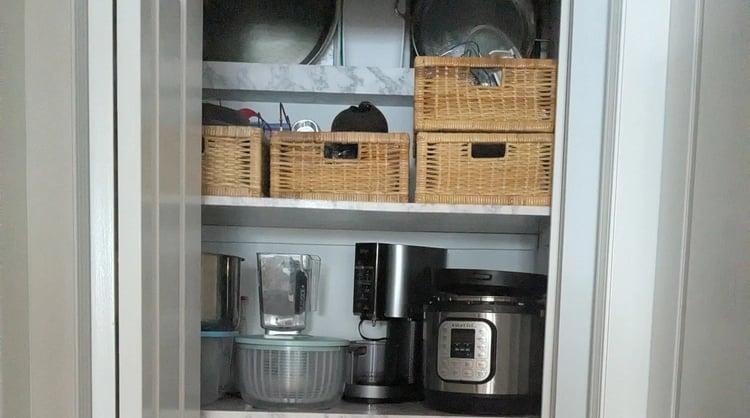 Organized kitchenware closet with strong shelving