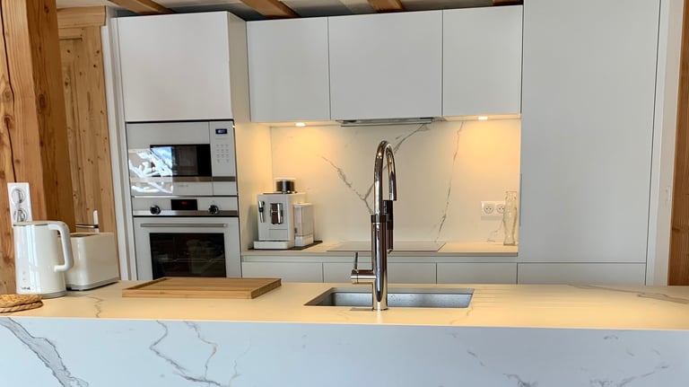 a kitchen with a marbled counter top